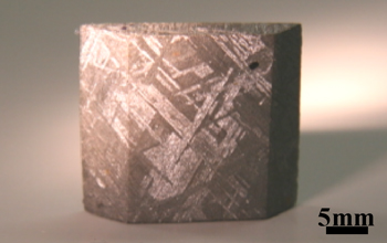 Fig. 1	Metallic microstructure observed in Widmanstatten structure of iron meteorites