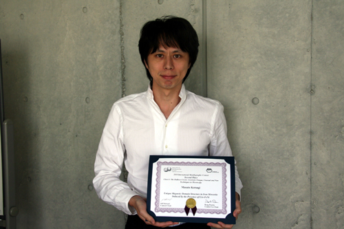 Dr. Masato Kotsugi with the award certificate
