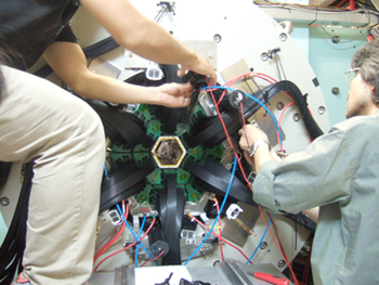 Figure 2. Charged particle detector and its adjustment.